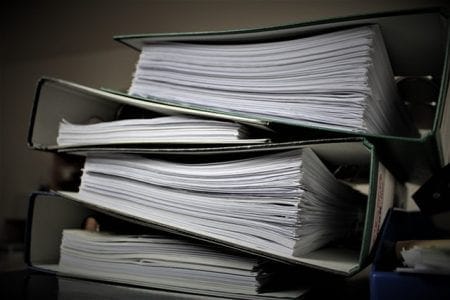 pile of court bundles for the article technological change long overdue in family law cases