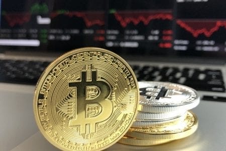 bitcoins hidden in divorce stacked in front of computer